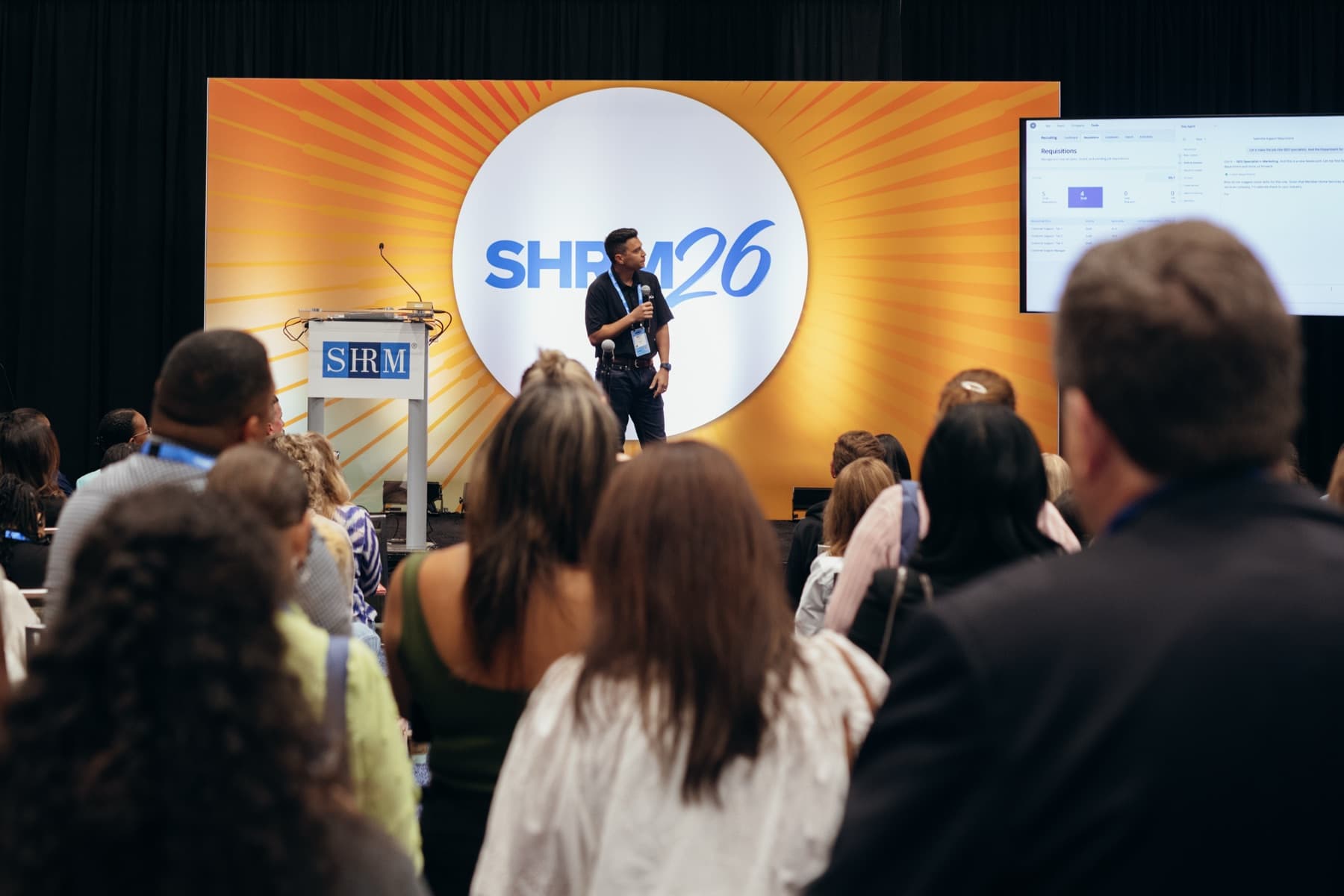 Matt Yang speaking on stage at SHRM26